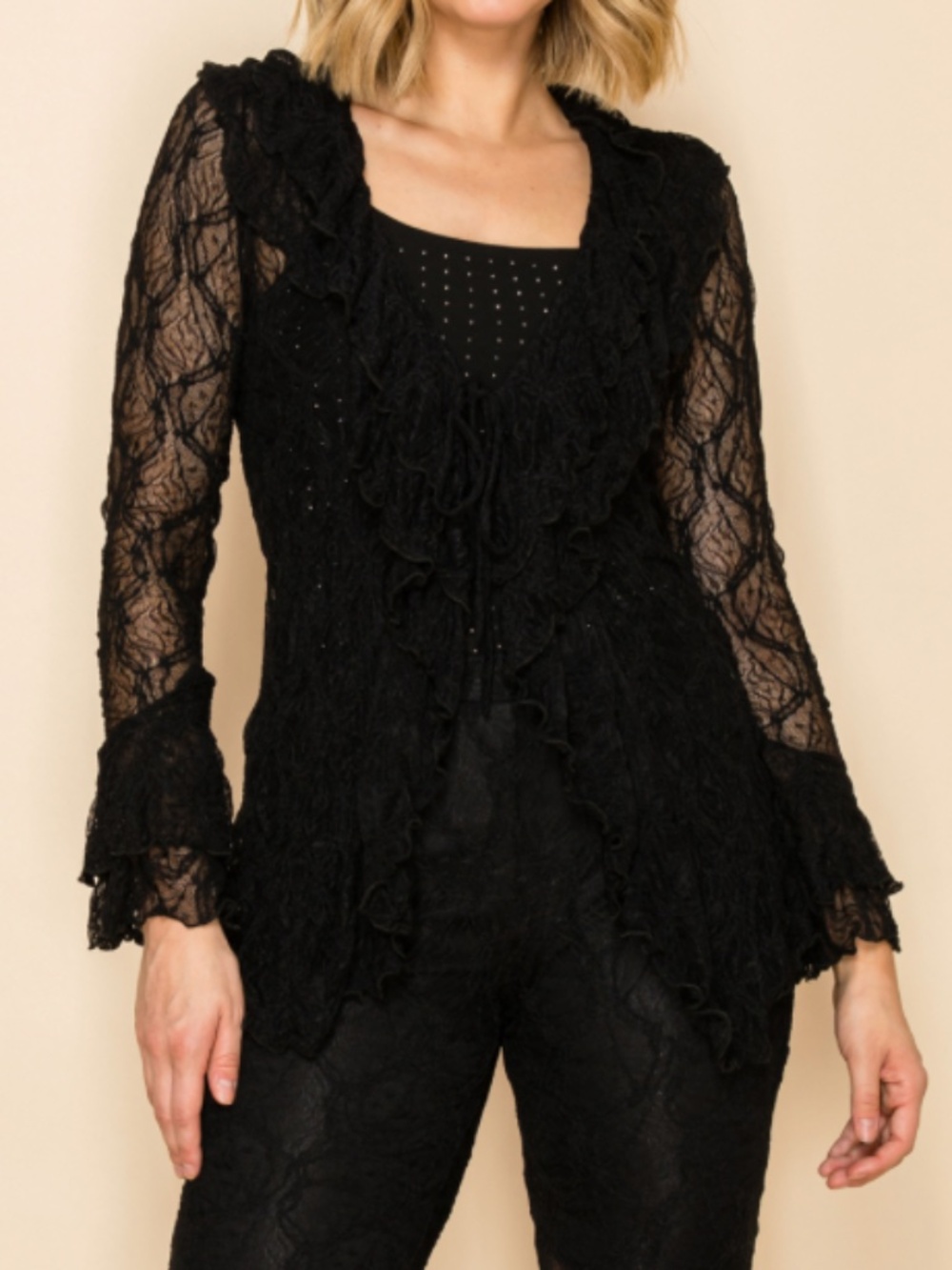 Vocal black lace cardigan with ruffle detail
